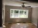 Inviting living room with a large window and hardwood floors provides natural light at 3140 Kipling Dr, Powder Springs, GA 30127