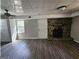 Open living room featuring a beautiful fireplace and sleek flooring, perfect for entertaining at 3140 Kipling Dr, Powder Springs, GA 30127