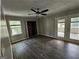 Living room with outdoor access via doors and big windows for great natural light and airflow at 3140 Kipling Dr, Powder Springs, GA 30127