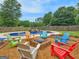 Enjoy the stunning backyard with a firepit, pool, and lush landscaping for outdoor fun at 552 New Hope Rd, Mcdonough, GA 30252