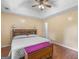 Bright bedroom featuring trey ceilings, wood floors, and custom headboard with lighting at 552 New Hope Rd, Mcdonough, GA 30252