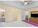 Bedroom with tray ceiling and ensuite bathroom, featuring a large bed and modern furnishings at 552 New Hope Rd, Mcdonough, GA 30252