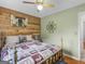 Stylish bedroom with wood paneled walls and a decorative mirror at 552 New Hope Rd, Mcdonough, GA 30252