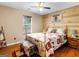 Cozy bedroom with rustic wood accents, a comfortable bed, and natural lighting at 552 New Hope Rd, Mcdonough, GA 30252