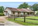 Ranch home featuring a cozy front porch and fenced yard on a lush green lawn at 552 New Hope Rd, Mcdonough, GA 30252