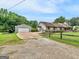 Charming home featuring a detached garage, boat shelter, and a lovely fenced yard at 552 New Hope Rd, Mcdonough, GA 30252