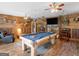 Entertaining game room featuring a pool table, unique wall decor, and relaxed seating perfect for leisure at 552 New Hope Rd, Mcdonough, GA 30252