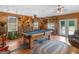 Rustic-themed game room with a pool table, wood paneling, and unique décor at 552 New Hope Rd, Mcdonough, GA 30252