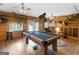 Spacious game room with wood paneled walls and a pool table for entertainment at 552 New Hope Rd, Mcdonough, GA 30252
