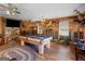 Spacious game room featuring a classic pool table, wood accents, and comfortable seating for entertainment at 552 New Hope Rd, Mcdonough, GA 30252