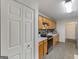 Efficient kitchen layout with ample wood cabinetry and stainless steel appliances and modern lighting at 552 New Hope Rd, Mcdonough, GA 30252