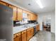 Kitchen with wood cabinets, modern appliances, and a sink overlooking a window for pleasant cooking experience at 552 New Hope Rd, Mcdonough, GA 30252