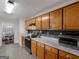 Well-equipped kitchen featuring wood cabinets, stainless steel appliances, and seamless access to the dining area at 552 New Hope Rd, Mcdonough, GA 30252