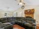 Comfortable living room with a large sectional sofa, fireplace, and open layout leading to dining area at 552 New Hope Rd, Mcdonough, GA 30252