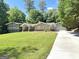 Beautiful home with lush lawn and mature trees, showcasing curb appeal and a welcoming driveway at 2062 Valiant Ne Dr, Atlanta, GA 30345