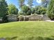 Charming home features a well-manicured lawn, mature trees and inviting curb appeal at 2062 Valiant Ne Dr, Atlanta, GA 30345