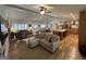 Open concept living room with beamed ceilings, modern fireplace and kitchen view at 2062 Valiant Ne Dr, Atlanta, GA 30345