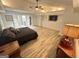 Spacious main bedroom featuring modern lighting, neutral colors and private bathroom entrance at 2062 Valiant Ne Dr, Atlanta, GA 30345