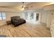 Well-lit main bedroom with hardwood floors, beamed ceiling and large bathroom at 2062 Valiant Ne Dr, Atlanta, GA 30345