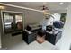 Relaxing covered patio featuring comfortable seating, ceiling fan, and stylish decor perfect for outdoor entertaining at 2062 Valiant Ne Dr, Atlanta, GA 30345