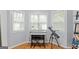Bright room featuring a keyboard, telescope, and three windows, perfect for hobbies and relaxation at 312 Iron Horse Way, Stockbridge, GA 30281