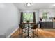 Cozy dining area with a round table and a view of the backyard at 312 Iron Horse Way, Stockbridge, GA 30281