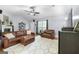 Spacious living room with a vaulted ceiling, ceiling fan, and hardwood flooring throughout at 312 Iron Horse Way, Stockbridge, GA 30281