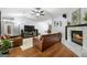 Bright living room with hardwood floors, a fireplace, and comfortable seating for relaxing at 312 Iron Horse Way, Stockbridge, GA 30281