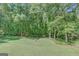 Expansive backyard surrounded by lush greenery offers privacy and tranquility at 1572 Hines Rd, Moreland, GA 30259