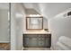 Cozy bathroom featuring granite vanity, tiled floors and a mirror at 1572 Hines Rd, Moreland, GA 30259