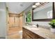 Beautiful bathroom featuring a tiled shower, granite counters, and a dark wood vanity at 1572 Hines Rd, Moreland, GA 30259