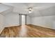 Large bedroom with wood floors and a sliding barn door closet at 1572 Hines Rd, Moreland, GA 30259