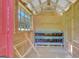Interior of chicken coop shows a roost and nesting boxes with plywood walls at 1572 Hines Rd, Moreland, GA 30259