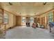 Garage interior features storage shelves, ample workspace, windows, and finished walls at 1572 Hines Rd, Moreland, GA 30259
