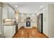 Modern kitchen featuring stainless steel appliances, granite countertops, and ample cabinet space for storage at 1572 Hines Rd, Moreland, GA 30259