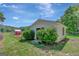 Exterior of white outbuilding with chicken coop and an enclosed run, offering versatile outdoor space at 1572 Hines Rd, Moreland, GA 30259