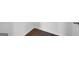 Close-up showcases new wood flooring with white trim, adding elegance to any room at 170 Aster Ave, Locust Grove, GA 30248