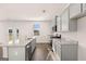 Bright kitchen features stainless steel appliances, granite counters, and center island at 170 Aster Ave, Locust Grove, GA 30248