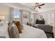 Serene bedroom with tray ceiling, sitting area, and large windows for natural light at 170 Aster Ave, Locust Grove, GA 30248