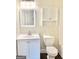 Bathroom with a toilet, vanity and a built in cabinet at 759 Hennepin Ter, Mcdonough, GA 30253