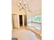 Elegant bathroom featuring a luxurious soaking tub, a separate shower, and a modern chandelier at 759 Hennepin Ter, Mcdonough, GA 30253