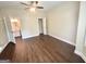 An empty bedroom with hardwood floors and access to the bathroom and a closet at 759 Hennepin Ter, Mcdonough, GA 30253