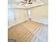 Spacious carpeted bedroom featuring double door closet and access to the rest of the home at 759 Hennepin Ter, Mcdonough, GA 30253