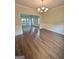 Charming dining room with wainscoting and a decorative chandelier at 759 Hennepin Ter, Mcdonough, GA 30253