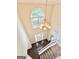 Grand foyer with a large arched window and chandelier at 759 Hennepin Ter, Mcdonough, GA 30253
