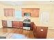 Spacious kitchen with granite countertops, stainless steel appliances, and wooden cabinets at 759 Hennepin Ter, Mcdonough, GA 30253