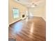 Bright living room featuring hardwood floors, fireplace, and plenty of natural light at 759 Hennepin Ter, Mcdonough, GA 30253