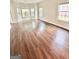 Bright room with hardwood flooring and ample windows offering natural light at 759 Hennepin Ter, Mcdonough, GA 30253