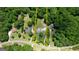 Aerial view of the home with surrounding neighborhood and tree coverage, showing property lines at 1130 Rawlings Dr, Rutledge, GA 30663