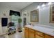 Inviting bathroom features double sinks, wood cabinets, and a large mirror at 1130 Rawlings Dr, Rutledge, GA 30663